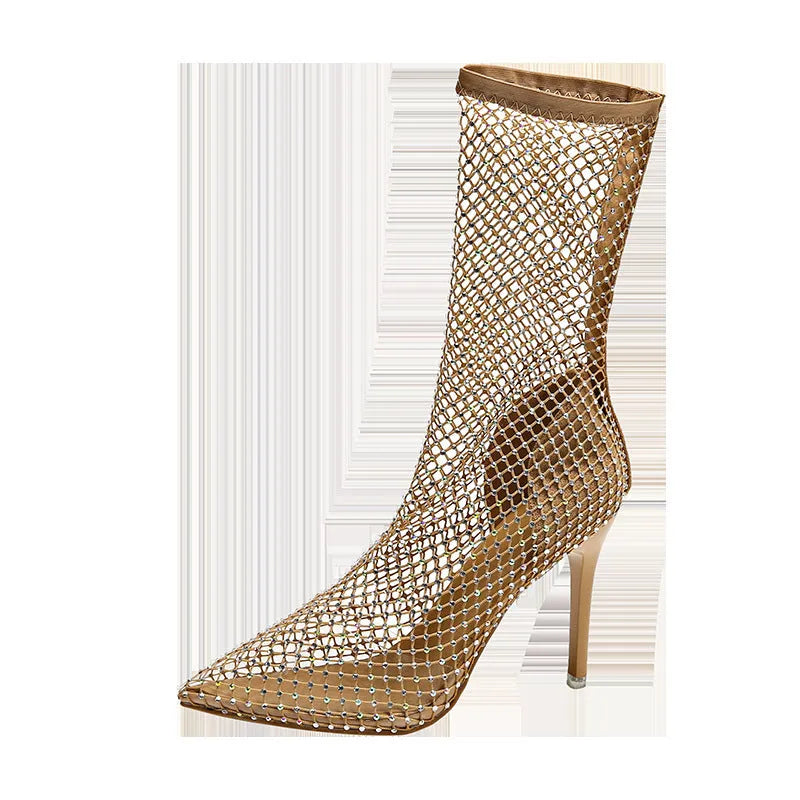 Gold pointed toe stiletto high heel sandals with a mesh upper and oversleeve design.