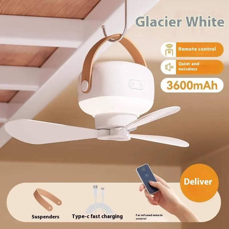 Small white rechargeable ceiling fan with remote control, mounted on a metal wire bracket.