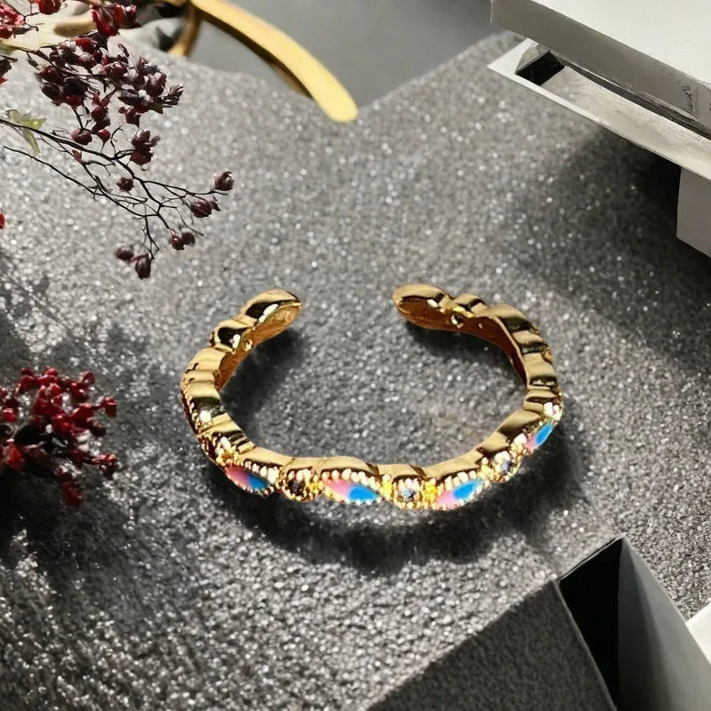 Adjustable copper gourd ring with inlaid zircon stones in a vintage oil dripping finish.