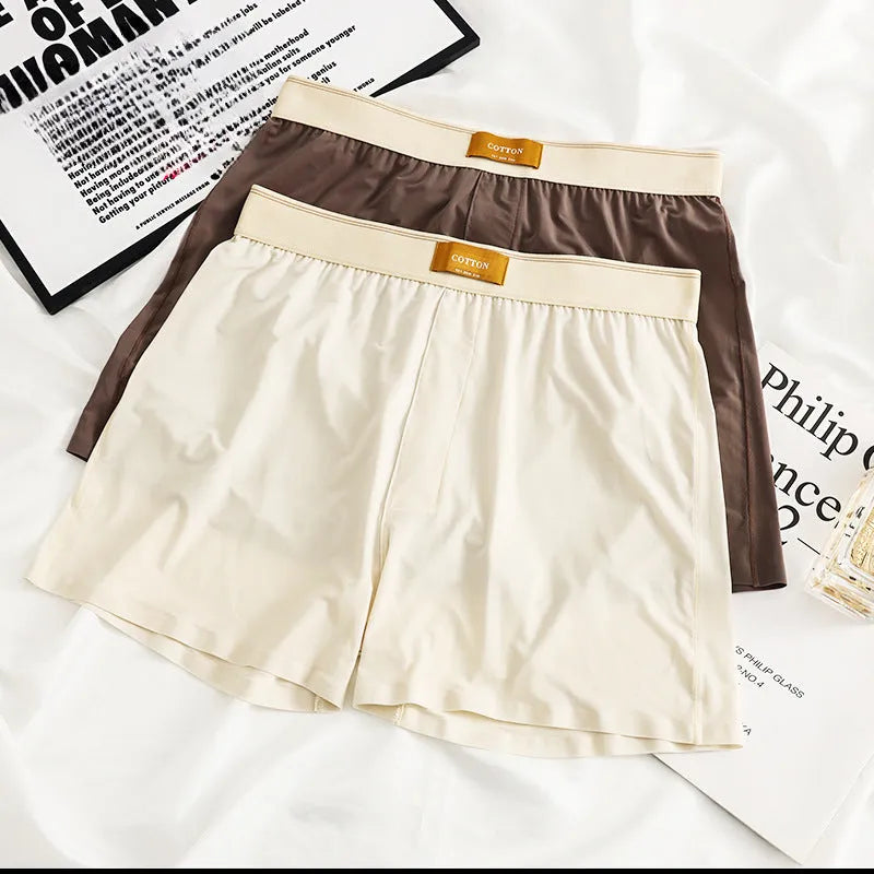 Three pairs of men's solid colour loose fit ice silk underwear in various colour combinations
