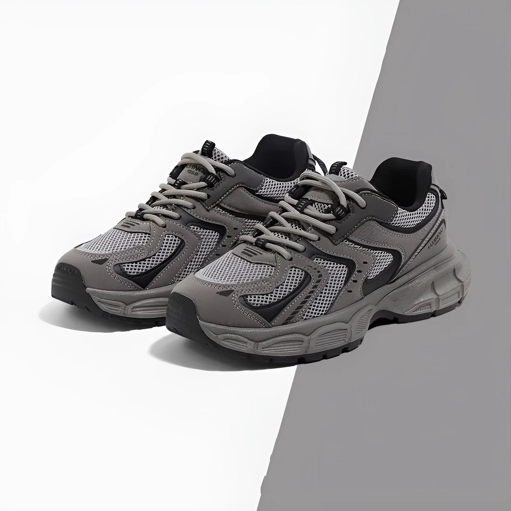 Gray low-top casual platform sneakers with leather stitching on a mesh upper and a light EVA sole.