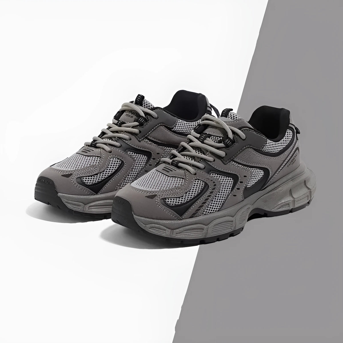 Gray low-top casual platform sneakers with leather stitching on a mesh upper and a light EVA sole.