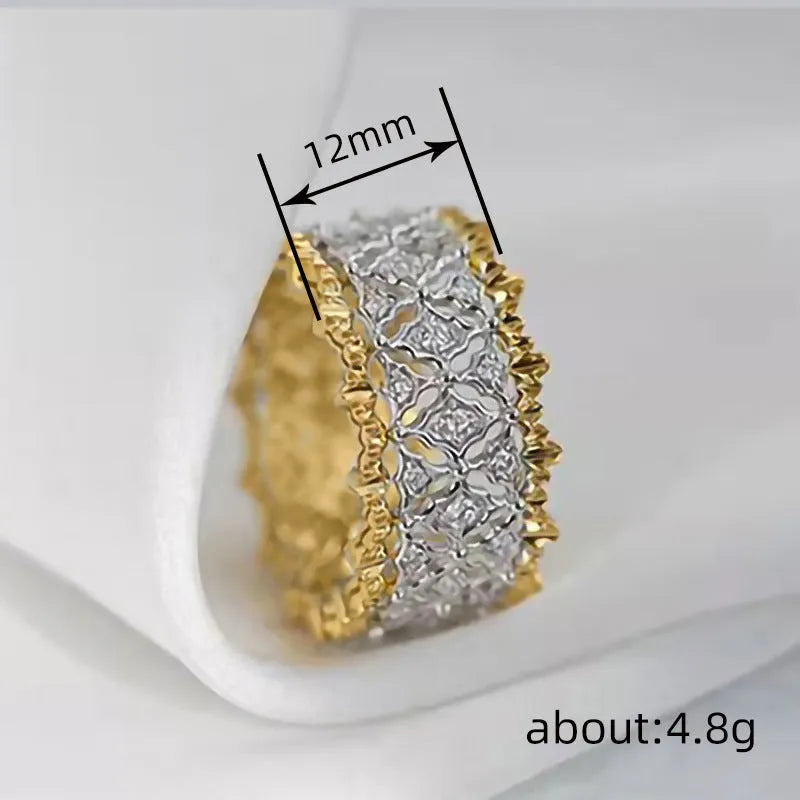 Gold two-tone geometric zircon ring on a copper band, showing round design detail.