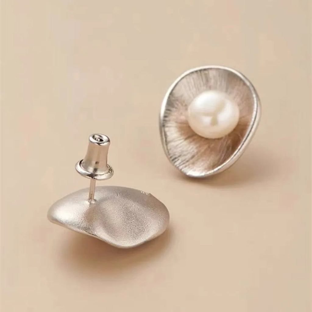 Pearl sterling silver needle earrings with geometric design and electroplated gold finish