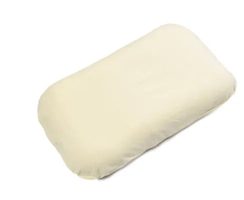 Beige portable cotton baby nest crib for newborn infants on a bed.