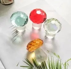 Colourful crystal mushroom decoration in modern geometric style on a white background.