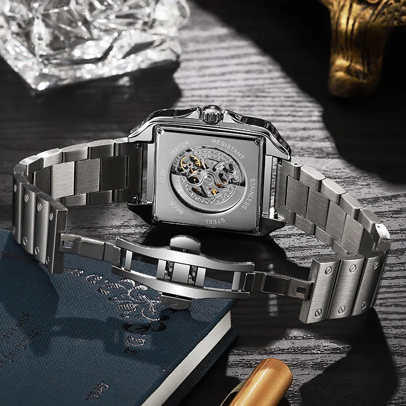 Men's square-faced automatic watch with diamond-studded bezel on a black leather strap