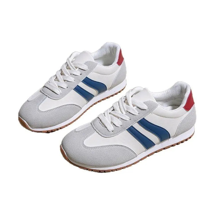 Blue and grey Cortez-style striped casual trainers with round toe and flat rubber sole.