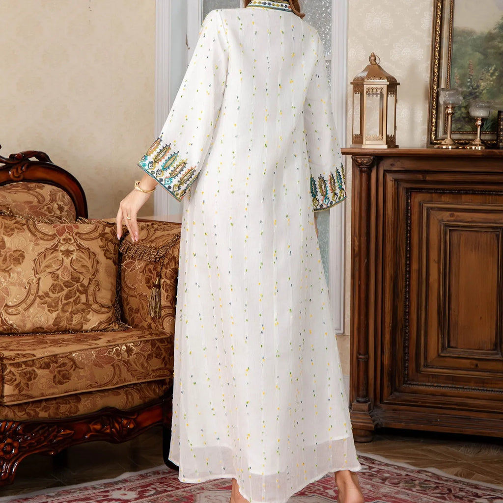 White women's Dubai Arabic robe with long sleeves and floor-length skirt.