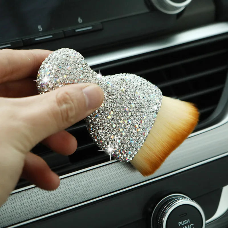 Soft PVC car interior cleaning brush for dust removal on dashboard and seats.