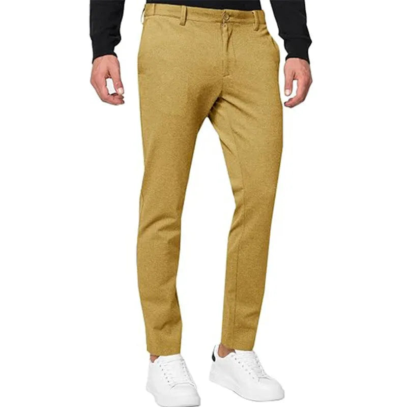 Men's slim-fit tapered chino trousers in a cotton blend stretch fabric on a hanger.