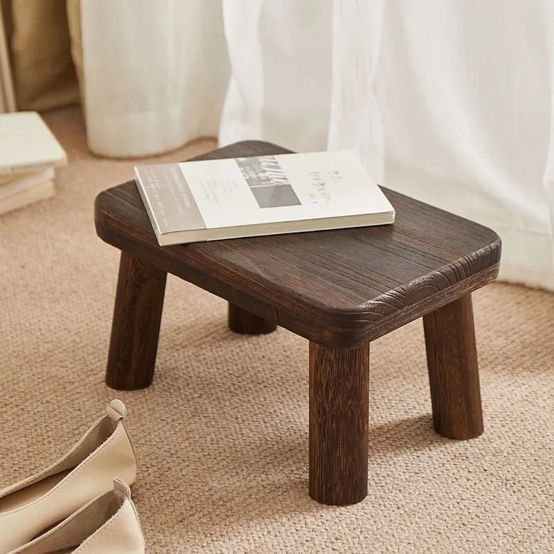 Distressed solid wood shoes changing stool with bracket structure for the living room.