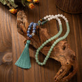 Vintage bohemian style beaded sweater chain with geometric beads and tassel pendant, shown with matching bracelet