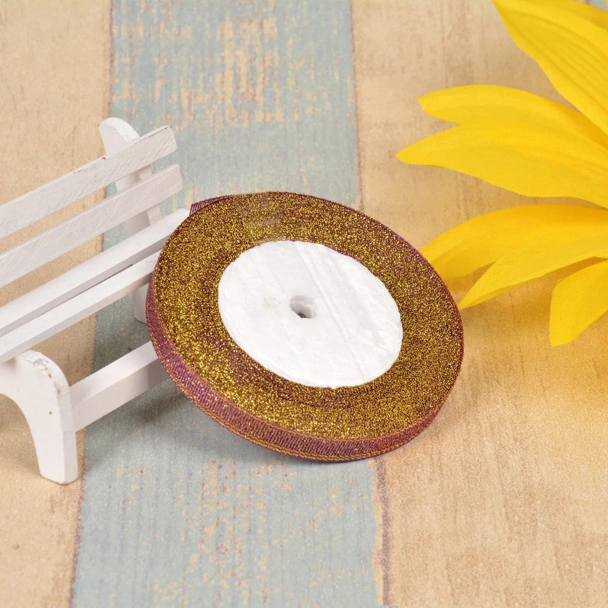 Green onion colour polyester ribbon with gold silk detailing measuring 1cm wide