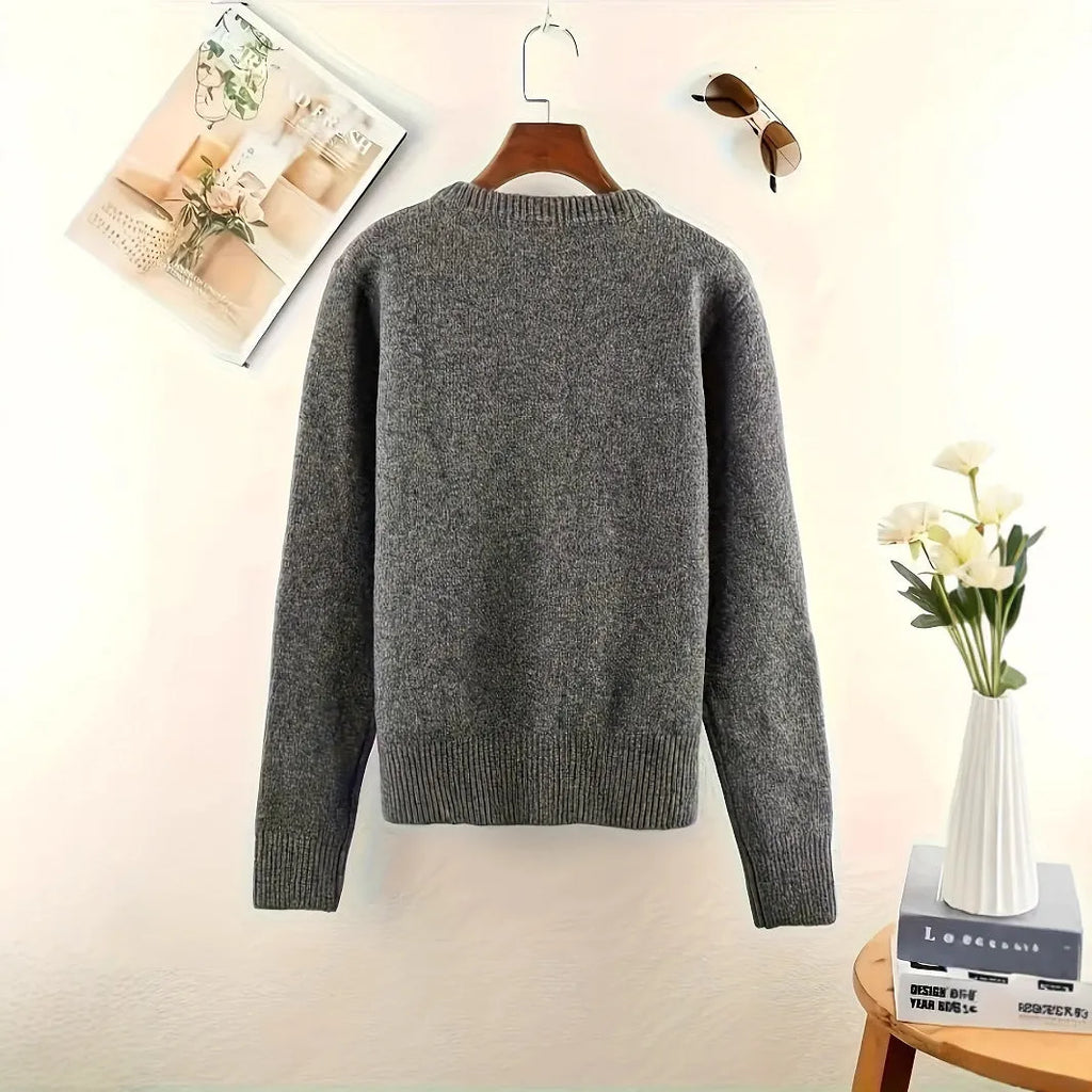Dark grey women's button-front cardigan sweater on a hanger, showing long sleeves and regular length.