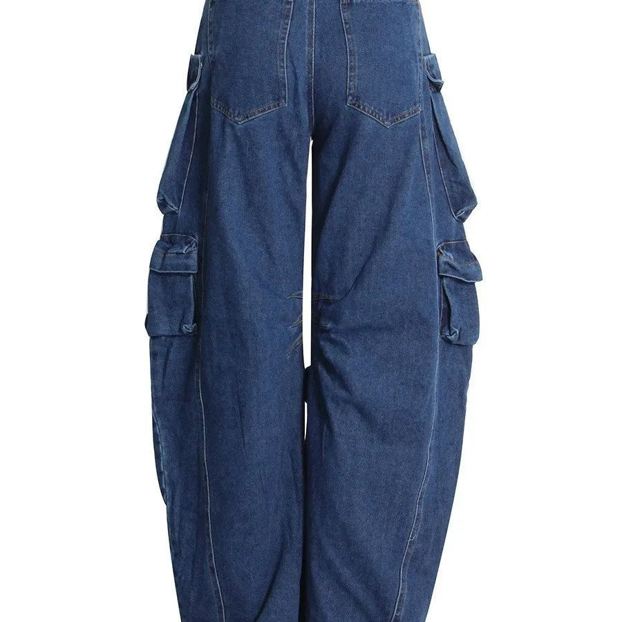 Dark blue distressed wide-leg jeans with high waist, multiple pockets, and raw hem detail