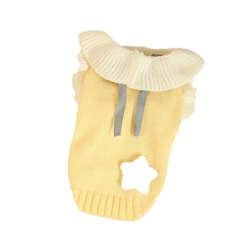 Yellow acrylic puppy sweater for small dog on size guide showing XS S M L XL chest measurements.