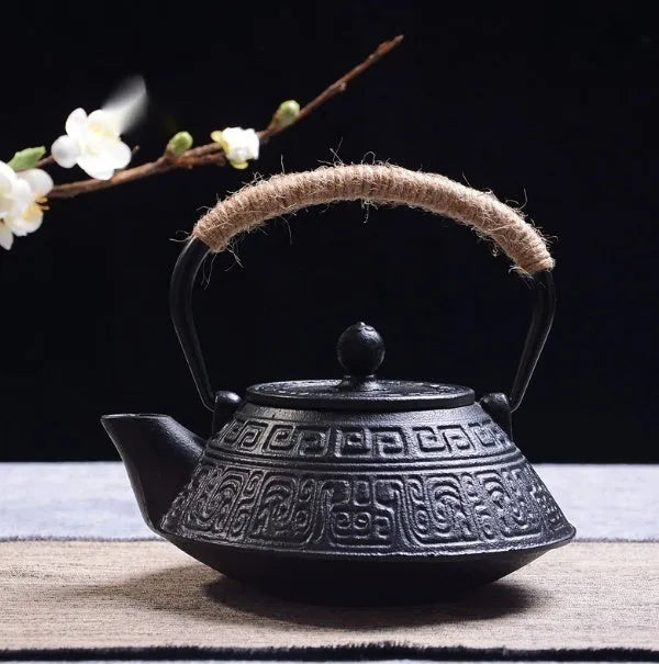 Cast iron teapot with Japanese decorative pattern and enamel interior, 0.9 litre capacity