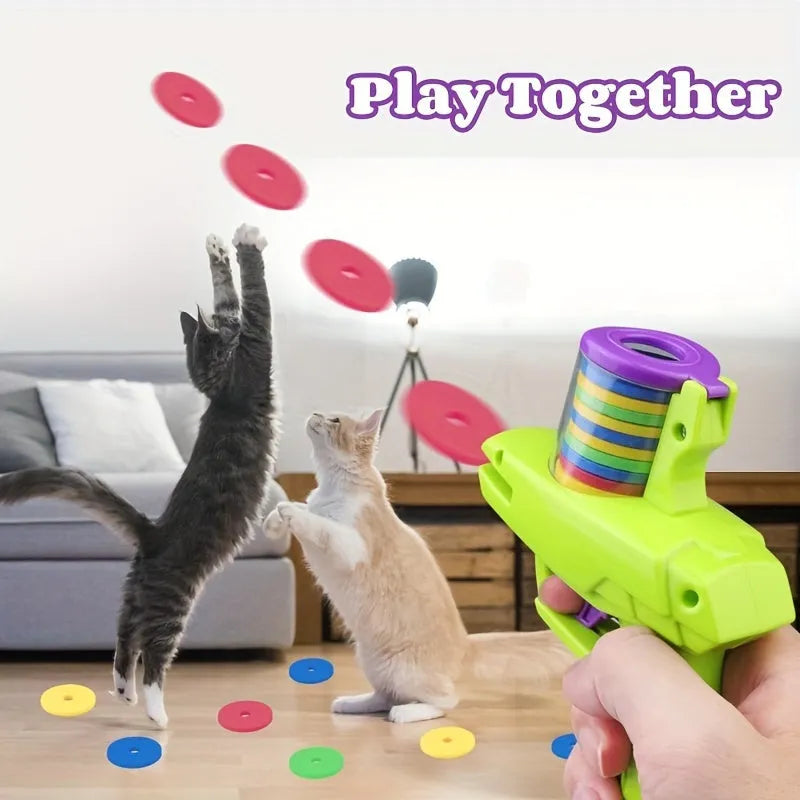 Interactive cat toy launcher with foam discs in green or purple colours