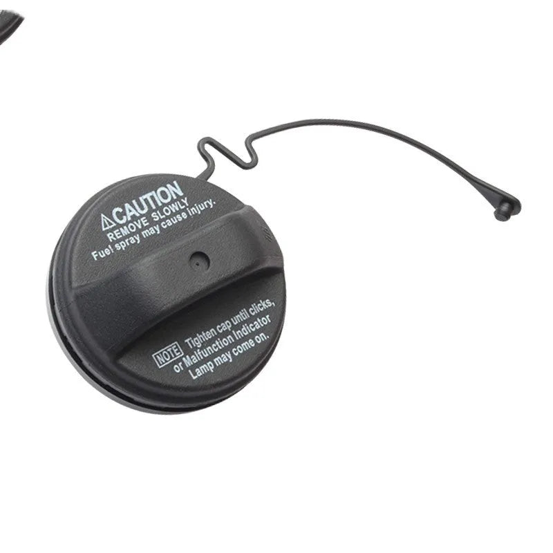 Snap-type fuel tank cap replacement part for Toyota vehicles.