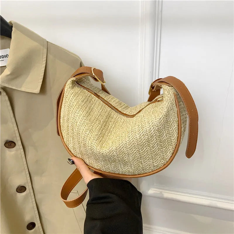Women's straw woven crossbody bag showing woven texture and internal organisation with phone pocket