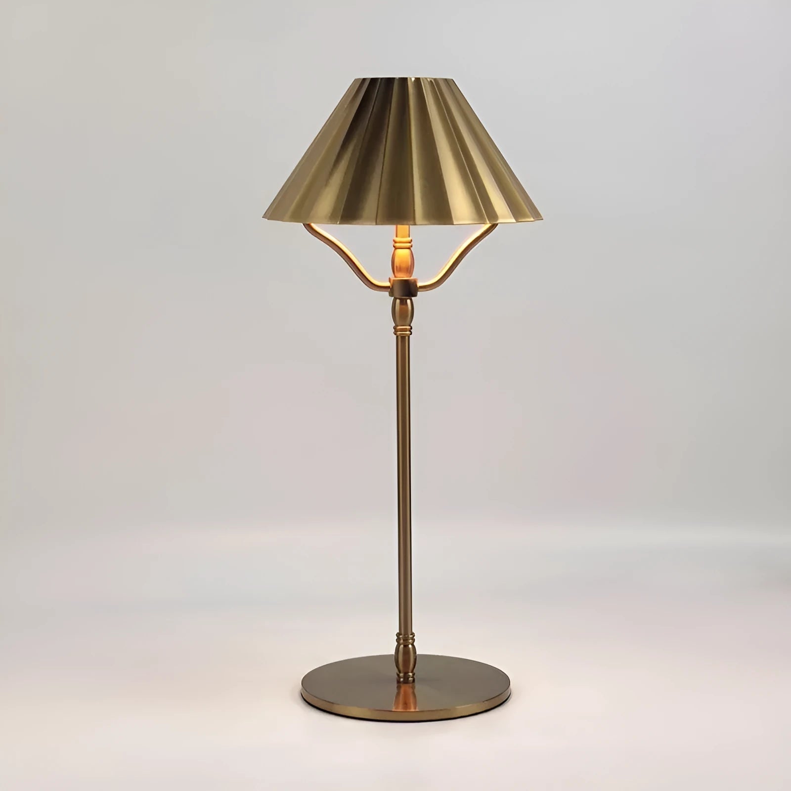 Gold alloy desk lamp with touch controls and Type-C charging port on a wooden desk
