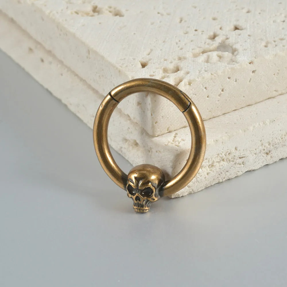 Copper punk earrings with vintage ghost head design in antique gold finish