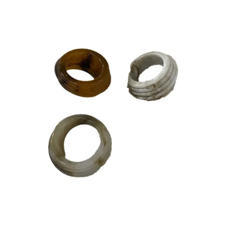 Resin ring with irregular geometric wide band design in brown and white colour options