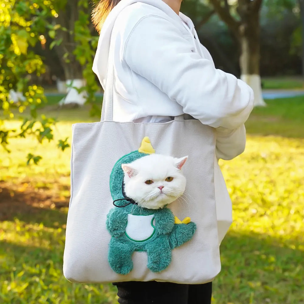Canvas pet carrier backpack for cats and small dogs on a shoulder strap showing cartoon pattern options.