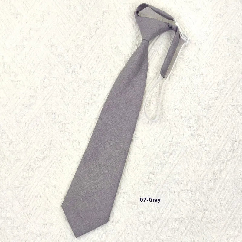 Navy blue cotton bow tie with arrow style shape measuring 35cm by 7cm
