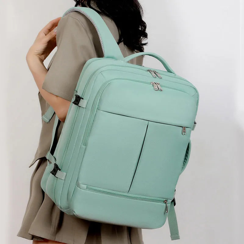 Large waterproof Oxford cloth backpack with multiple pockets, shown in one of five colours, holding a 15.6 inch laptop.