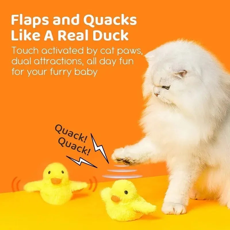 Yellow chick-shaped flapping duck cat toy with plush fabric on a floor.