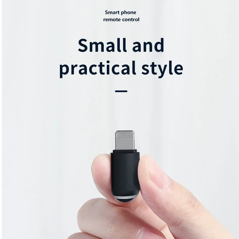 Black capsule infrared remote emitter with Lightning, USB-C, and micro-USB plug options on a white background.
