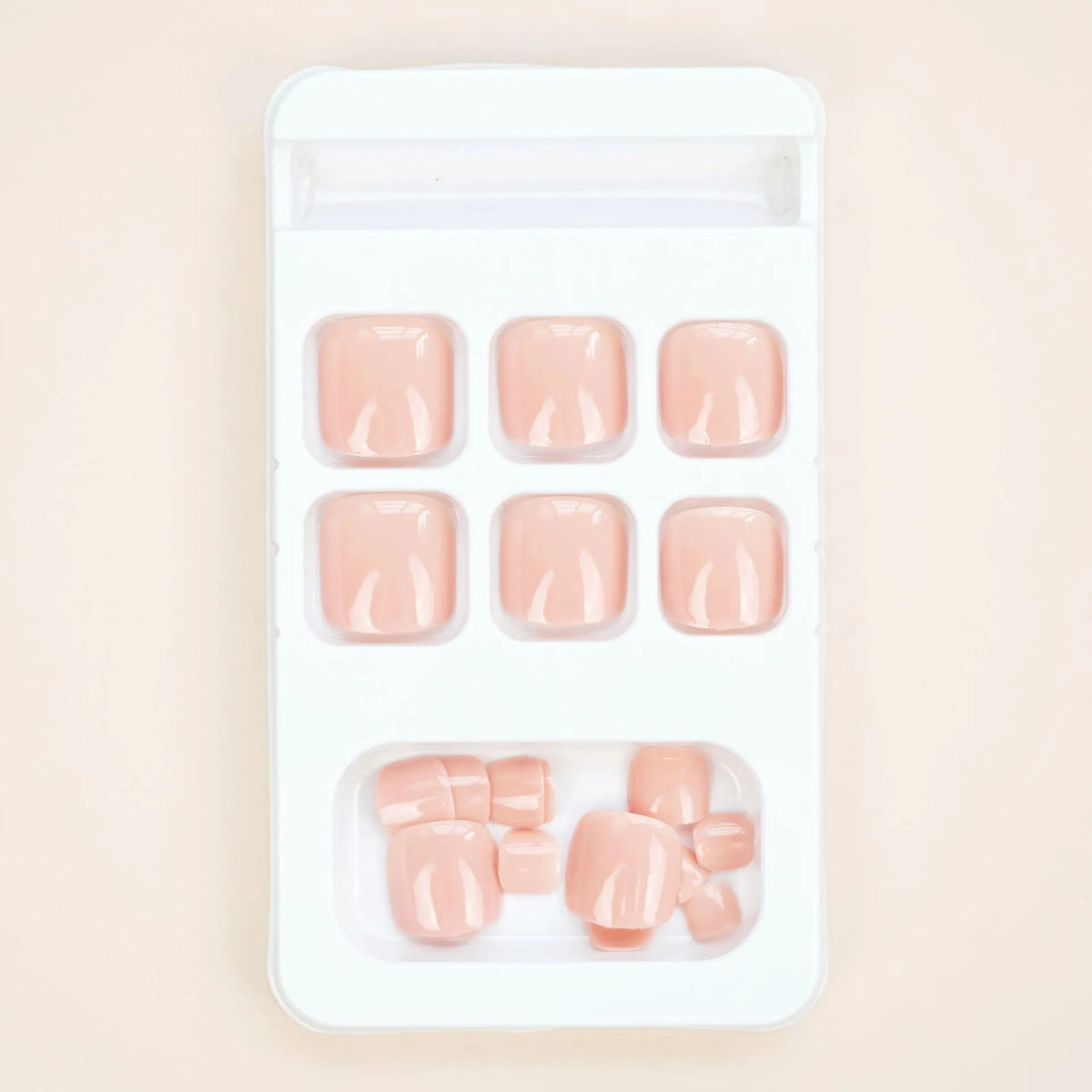 Finished plastic toe nail stickers in J-52 skin colour with adhesive glue for cosmetic application