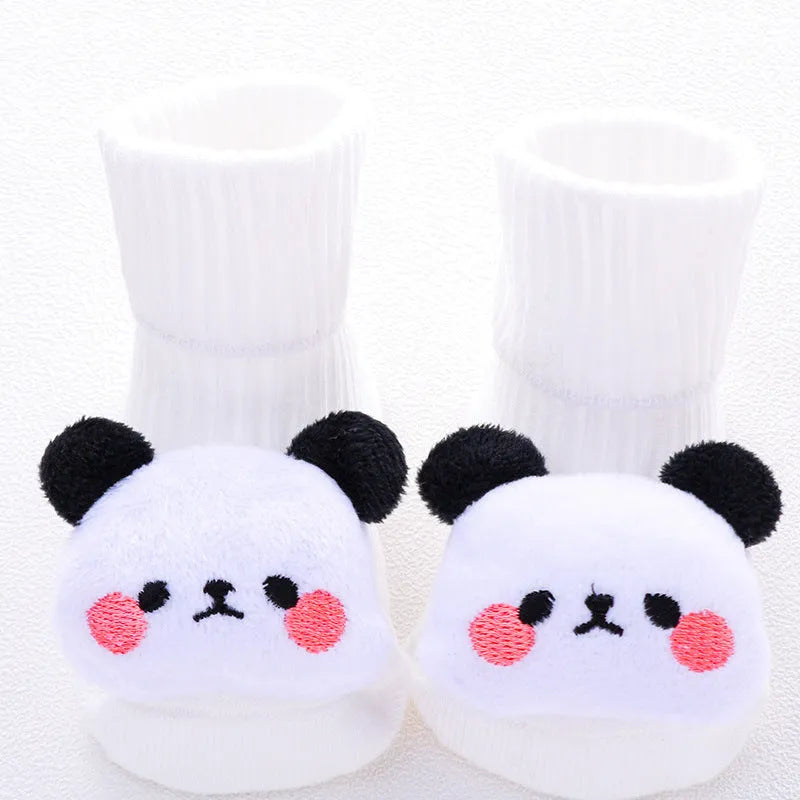 Cotton baby floor socks in various designs including blue bow and lion, showing sizes for infants 0-3 months