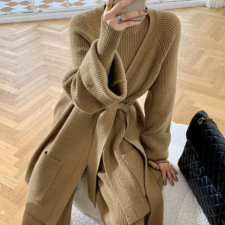 Women's knitted three-piece set showing top, wide-leg trousers, and cardigan in solid colour with leather stitching details