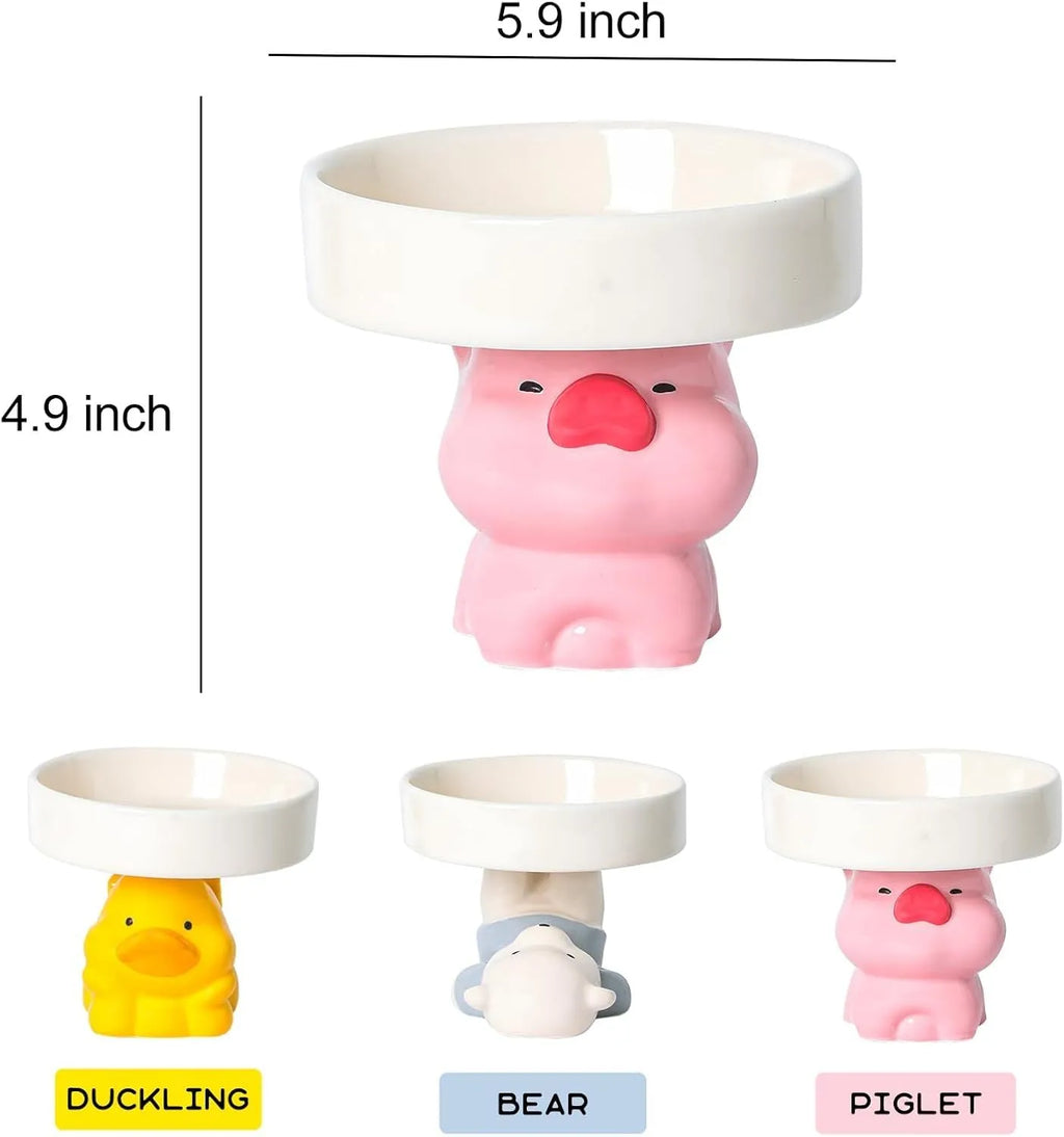Ceramic raised cat bowl with cute animal design, shown in pink pig, white bear, and yellow duck styles.