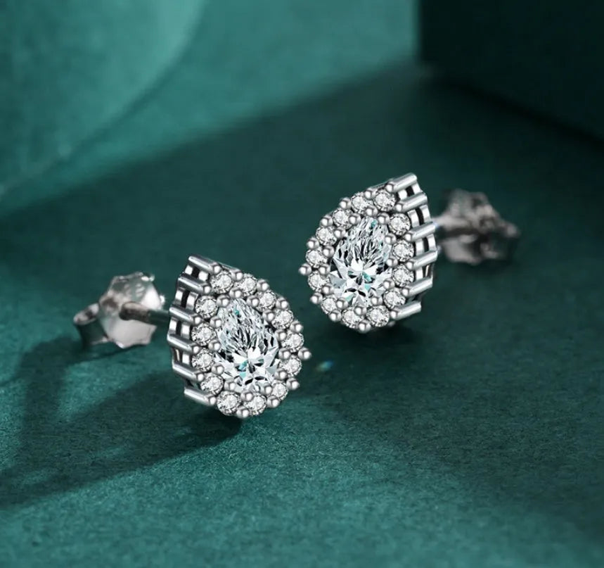 Women's silver water drop stud earrings crafted from 925 sterling silver with diamond treatment
