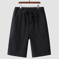 A pair of beige linen shorts for men with a loose, cropped fit and a mid-rise elasticated waistband.