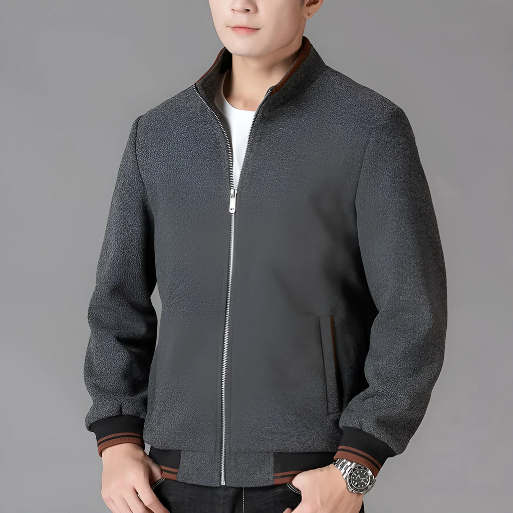Men's grey woolen fleece sports jacket with long sleeves and a size stick pocket.