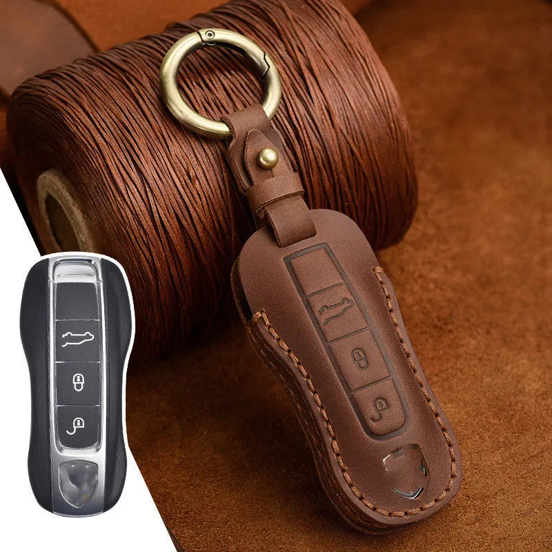 Porsche car key case made from brown cowhide leather with retro bag buckle closure