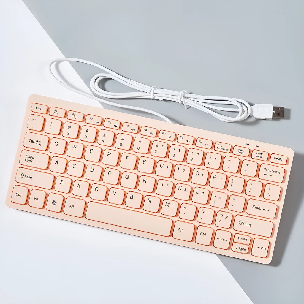 Compact wired USB keyboard in four colour options: black, white, pink, and blue