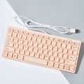 Compact wired USB keyboard in four colour options: black, white, pink, and blue