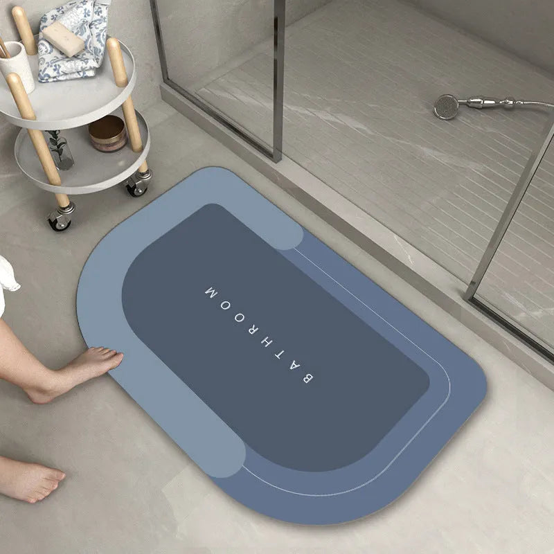 Blended fabric bathroom floor mat in blue colour, rectangular shape, on a tiled floor.