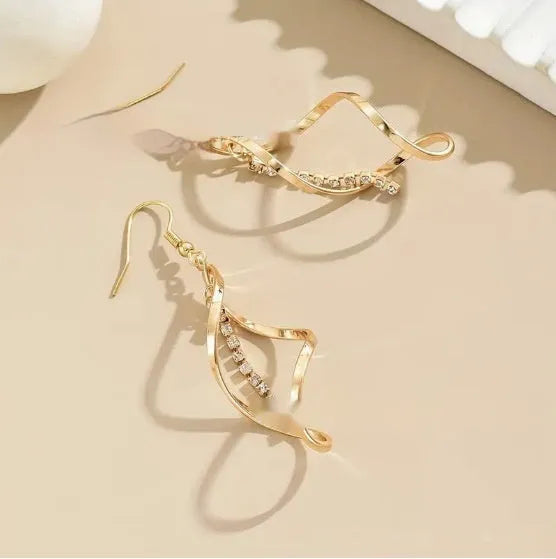 Gold spiral geometric earrings with ellipse diamond-style ornament for women