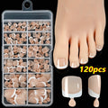 Box of 120 French white edge nude full square short artificial nail pieces showing nine colour shades