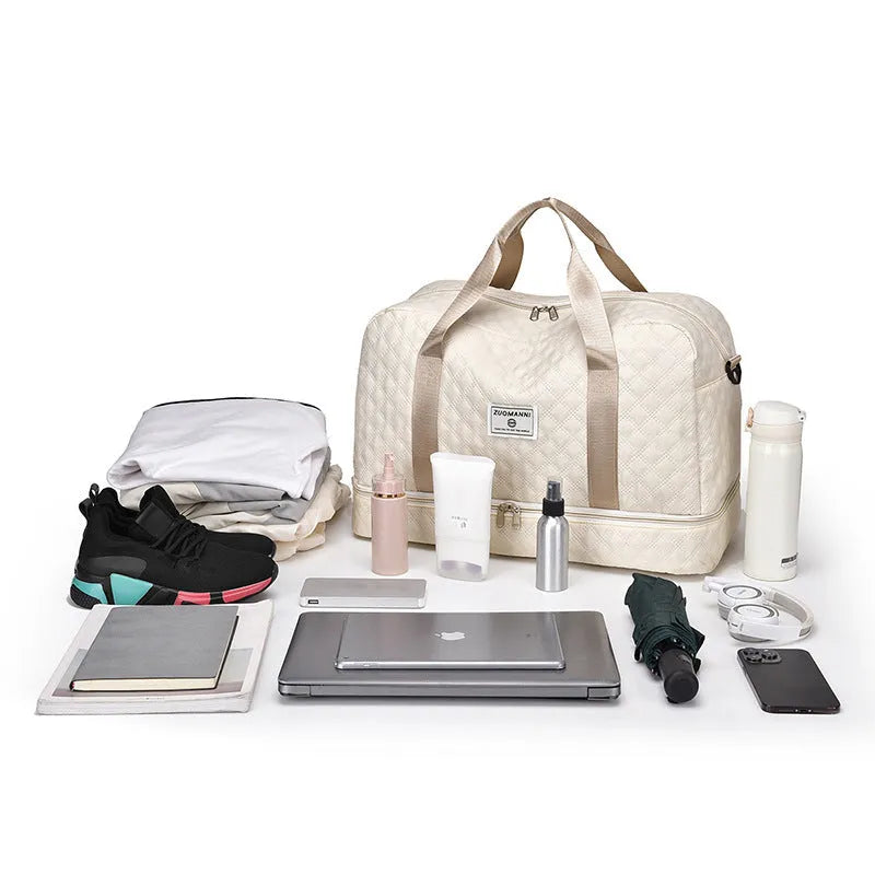 Oxford cloth travel bag in a solid colour with sewing thread detail, shown with 36-55L capacity.