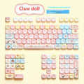 Clip doll themed mechanical keyboard keycaps with colourful doll artwork on key surfaces