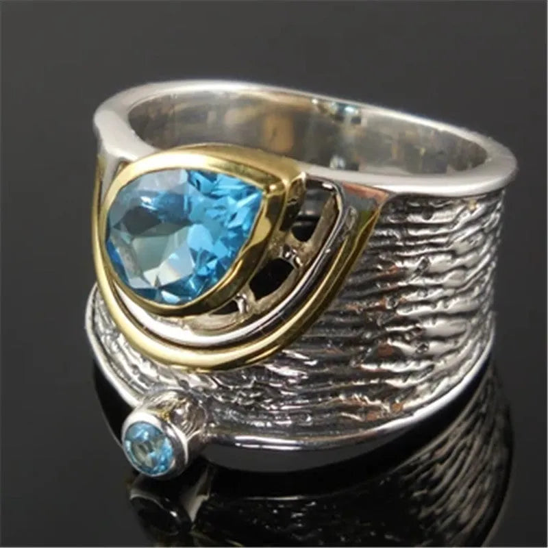 Blue zircon rhinestone ring in Chinese style with drop shape design on woman's hand