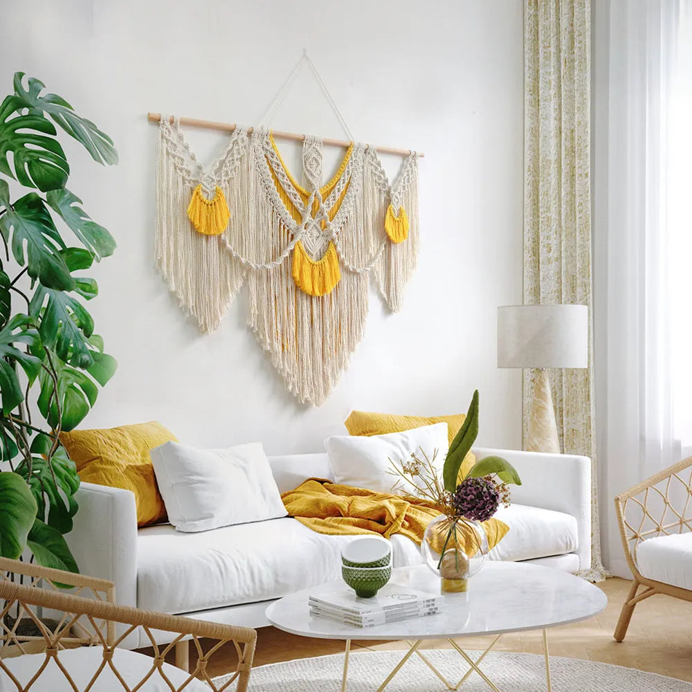 Creamy white hand-woven cotton Nordic tapestry hanging on a wall, 120cm wide by 95cm high.